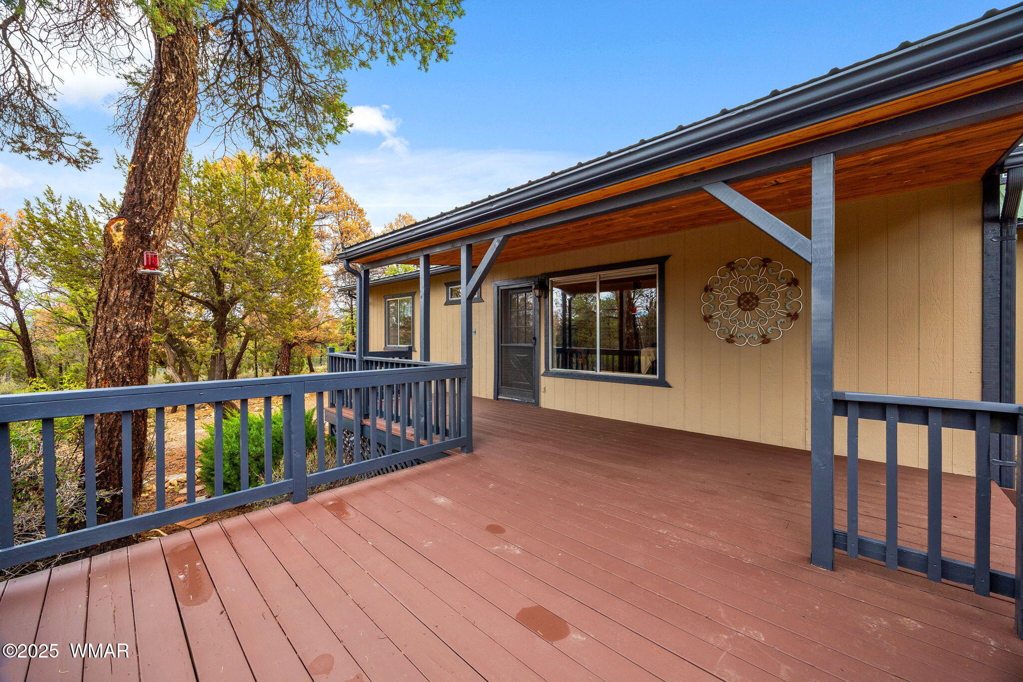 3154 Aspen Road Overgaard, AZ 85933 - Photo 27 of 36 a view of house with deck and wooden floor