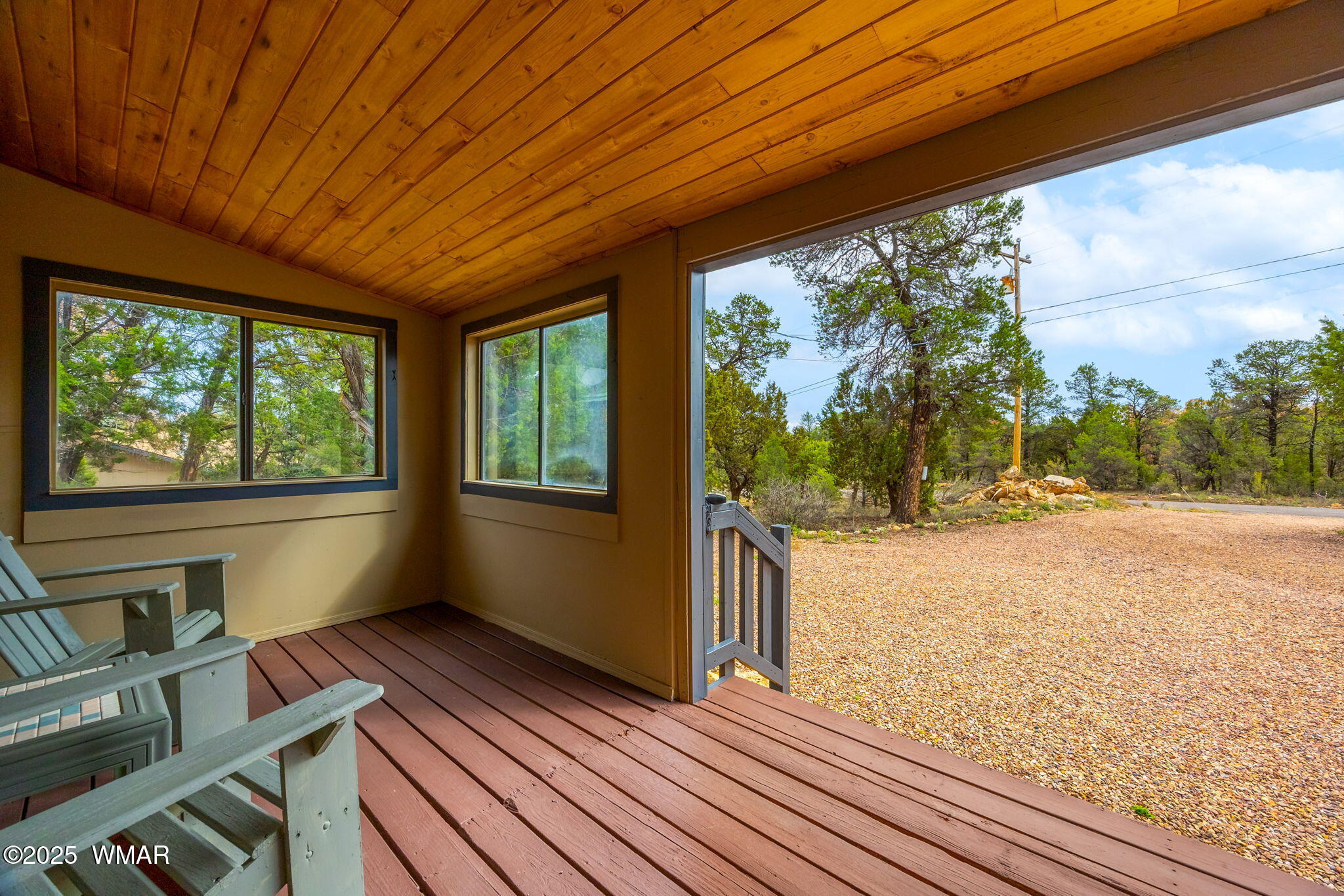 3154 Aspen Road Overgaard, AZ 85933 - Photo 4 of 36 a view of a porch with wooden floor and outer view
