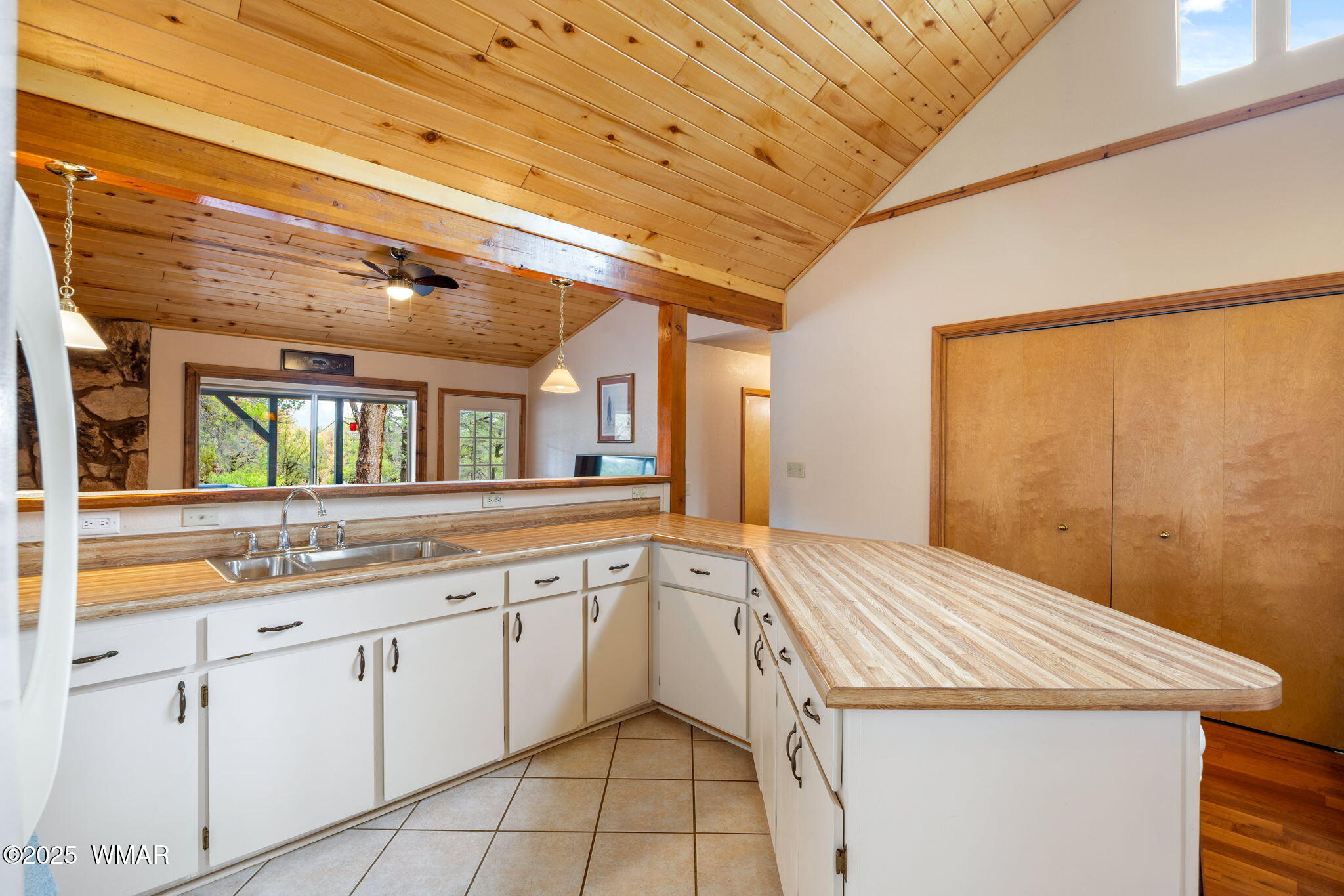 3154 Aspen Road Overgaard, AZ 85933 - Photo 10 of 36 a kitchen with a sink and cabinets