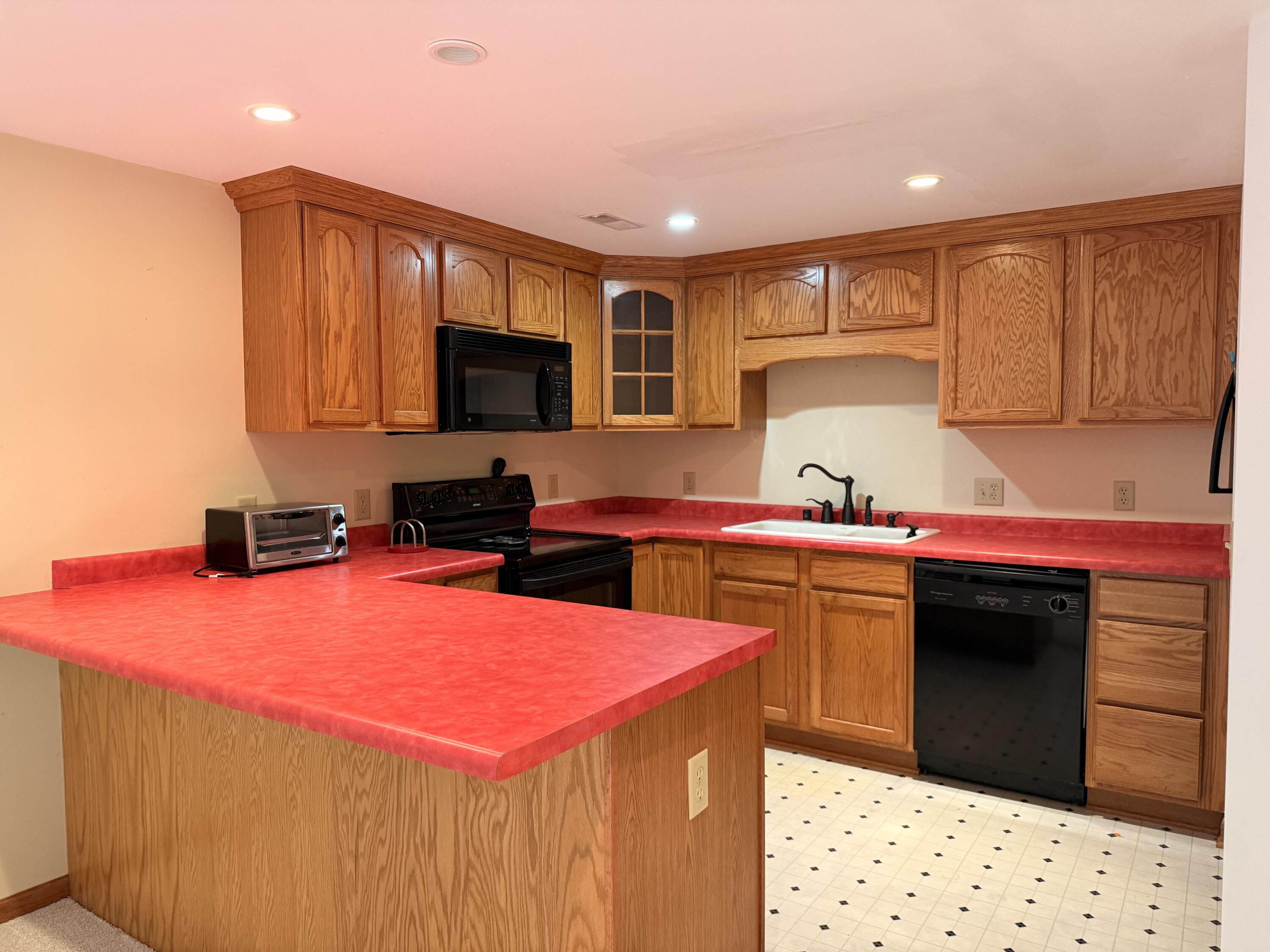 S85W19635 Colonial Court Muskego, WI 53150 - Photo 14 of 19 lower level kitchen