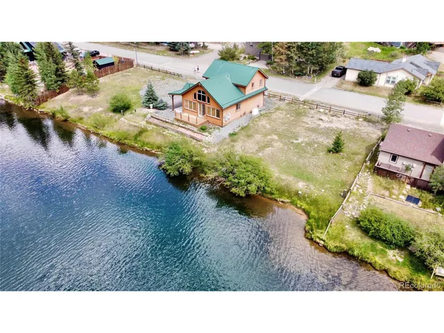 a view of a swimming pool with a yard