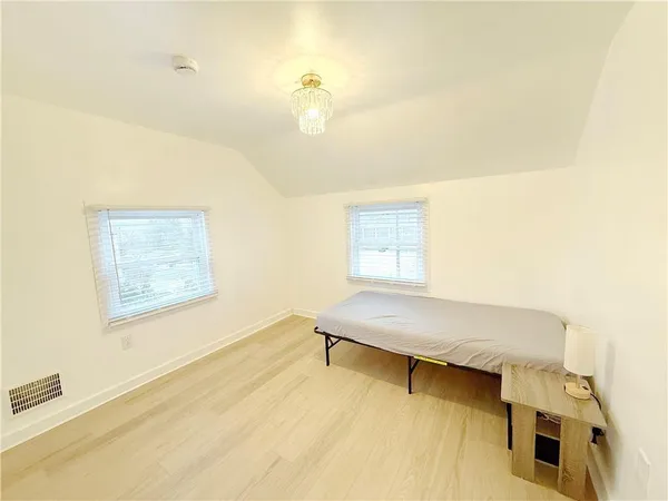 a room with pool table and windows