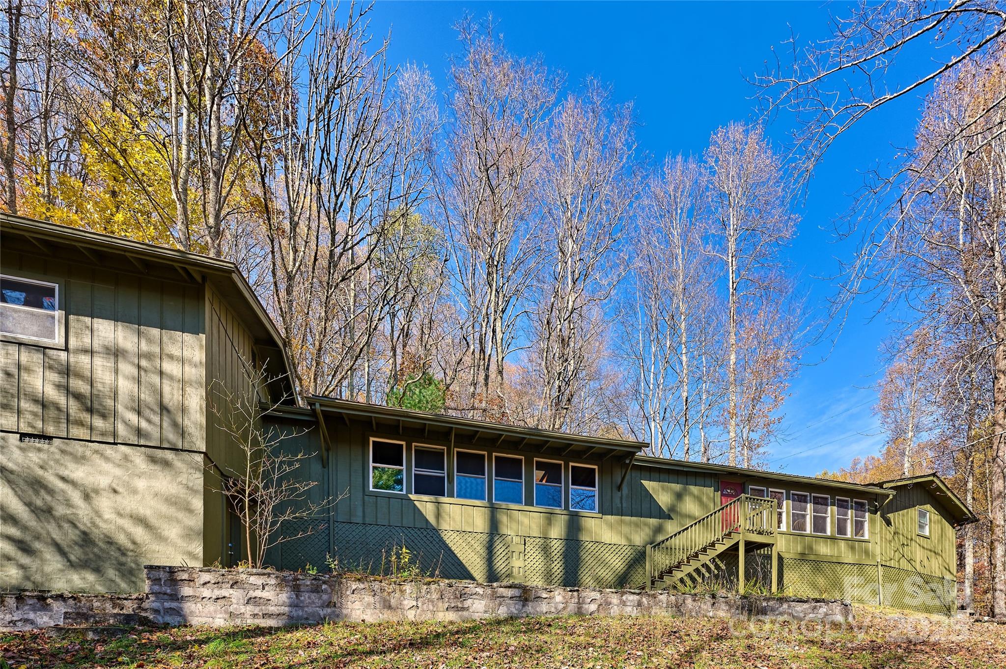 2626 Dendy Orchard Road Highlands, NC 28741 - Photo 26 of 33 a view of wooden house with a trees in the background