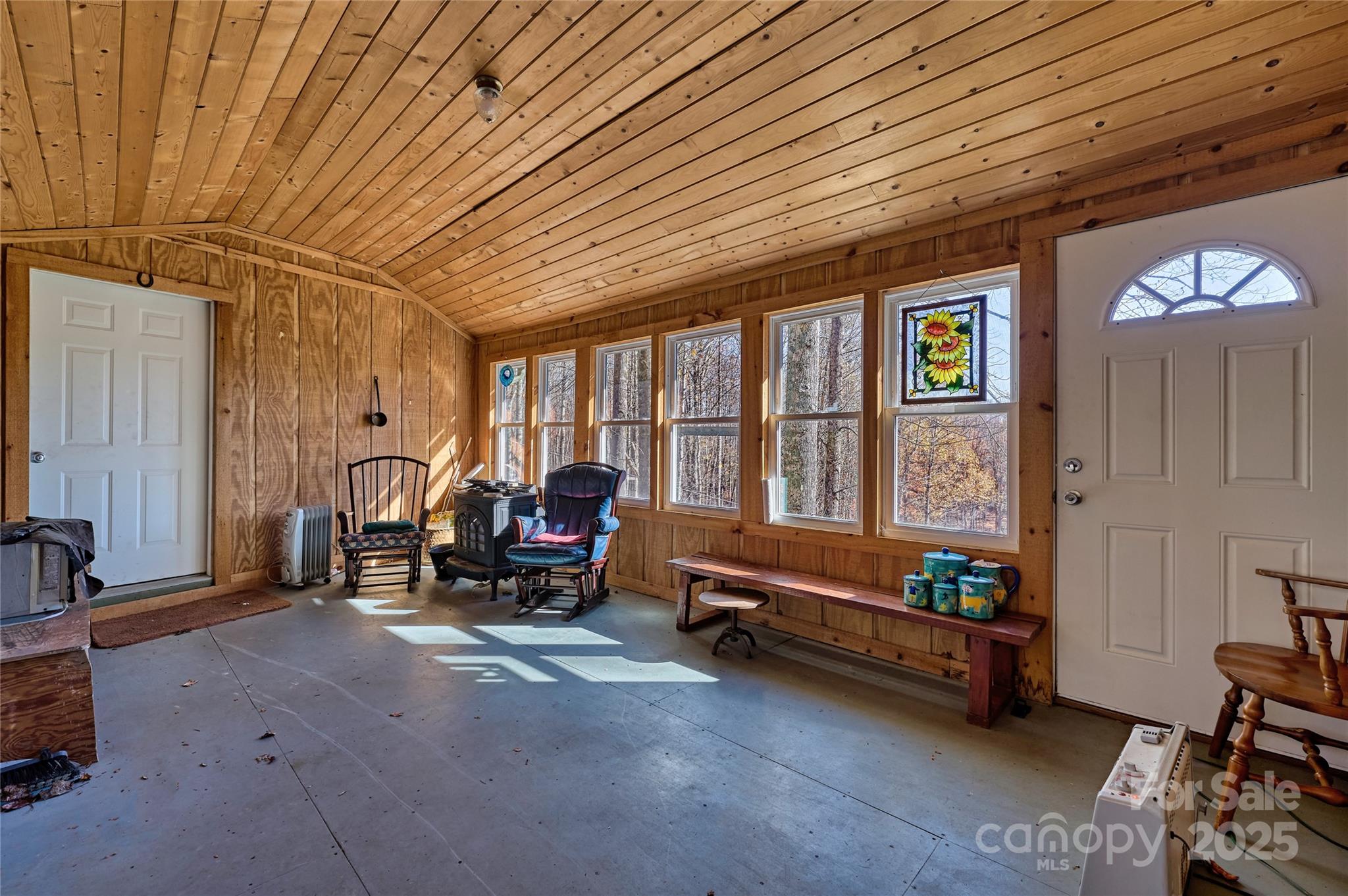 2626 Dendy Orchard Road Highlands, NC 28741 - Photo 27 of 33 a bedroom with furniture and large windows