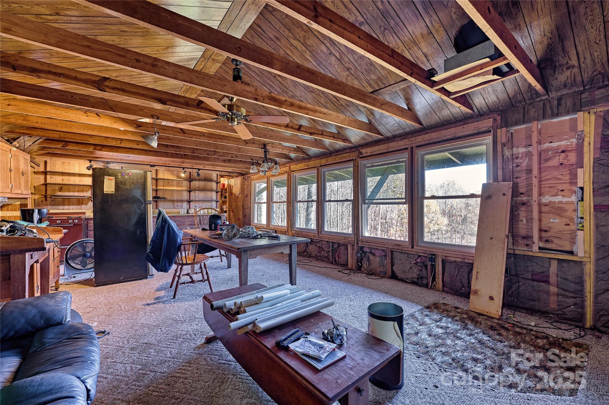 2626 Dendy Orchard Road Highlands, NC 28741 - Photo 30 of 33 a living room with furniture a wooden floor and next to a window