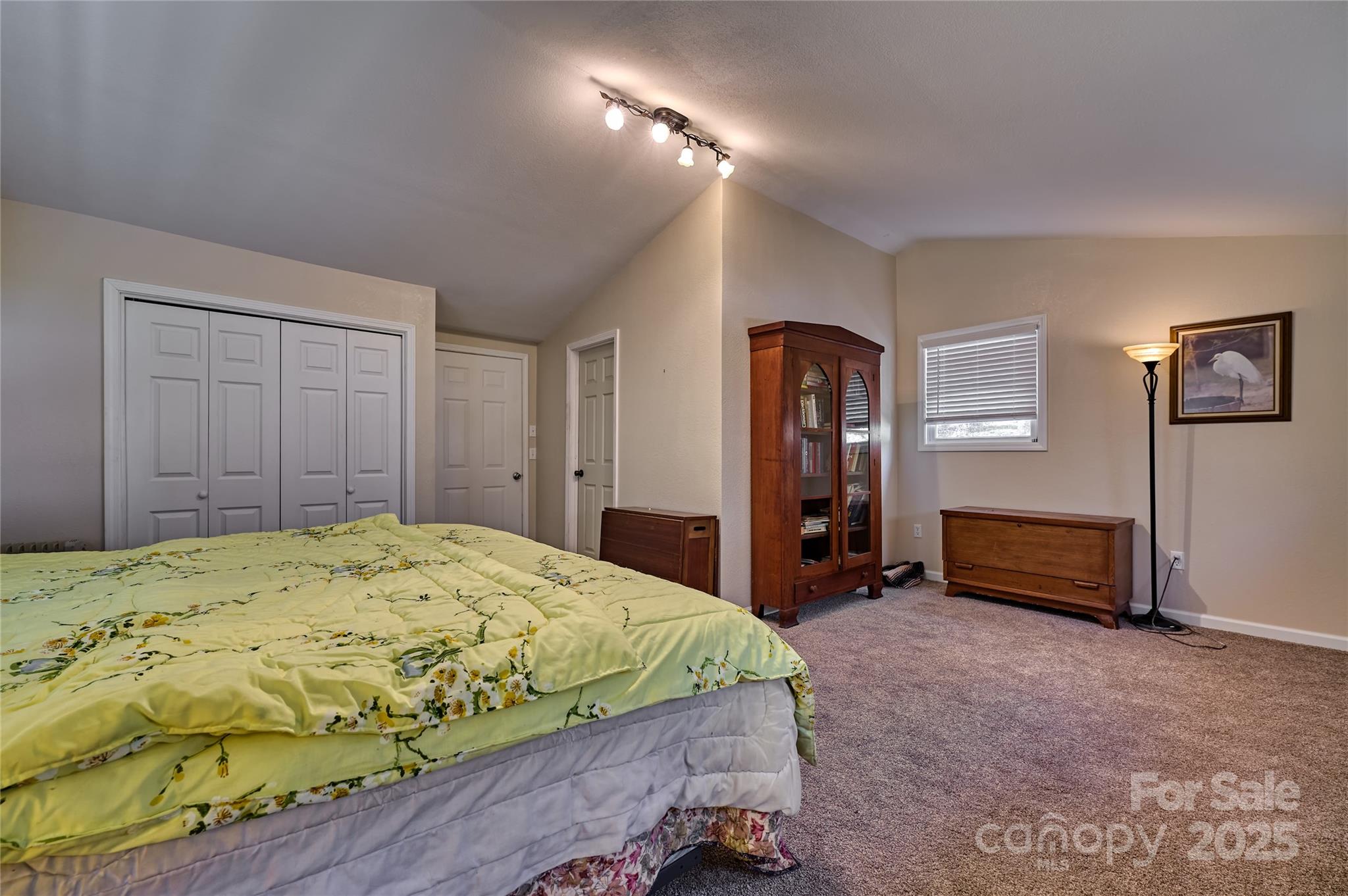 2626 Dendy Orchard Road Highlands, NC 28741 - Photo 32 of 33 a bedroom with a bed and a cabinets