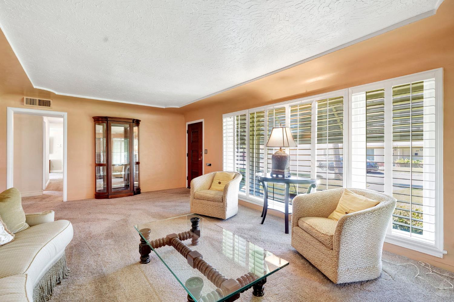 200 Lyons Street Madera, CA 93638 - Photo 9 of 32 a living room with furniture and floor to ceiling windows