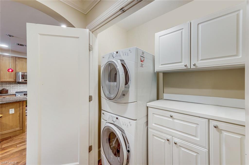 9123 Strada Place, Unit 7201 Naples, FL 34108 - Photo 18 of 50 a utility room with dryer and washer