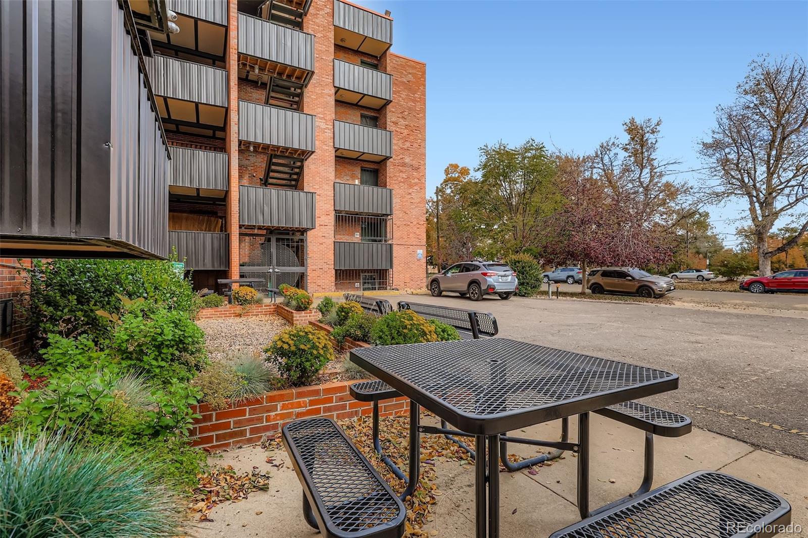 1833 North Williams Street, Unit 206 Denver, CO 80218 - Photo 19 of 29 a view of backyard with outdoor seating