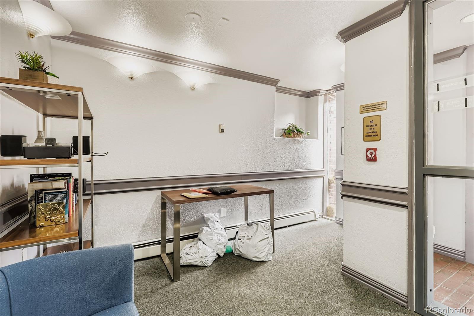 1833 North Williams Street, Unit 206 Denver, CO 80218 - Photo 20 of 29 a utility room with cabinets dryer and washer