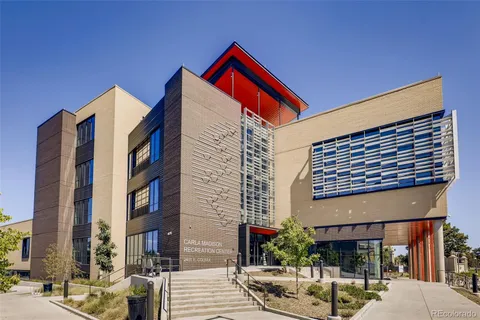a wooden bench sitting in the middle of a park
