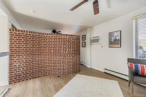 a view of wooden floor with a bathroom