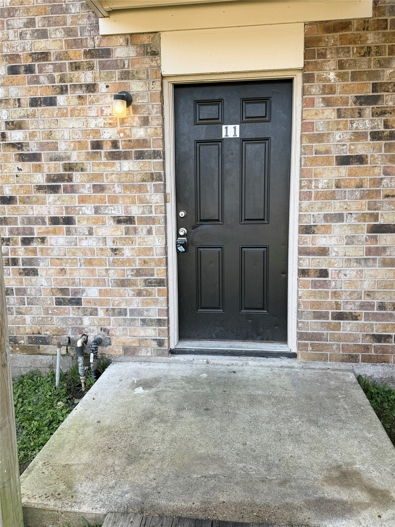 1614 Vauthier Street, Unit 11 La Marque, TX 77568 - Photo 3 of 16 a front view of a house with a yard