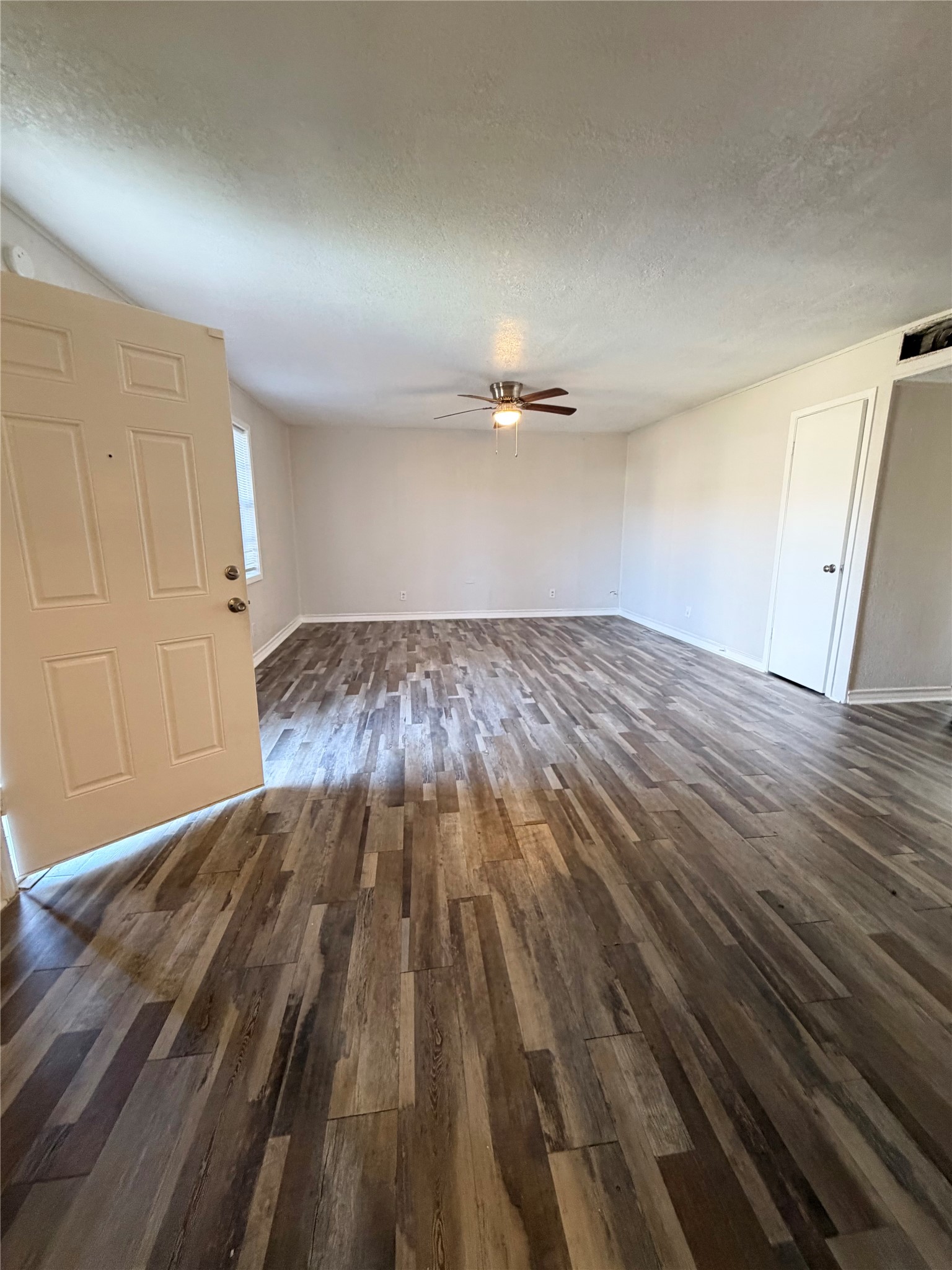 1614 Vauthier Street, Unit 11 La Marque, TX 77568 - Photo 5 of 16 a view of a room with wooden floor