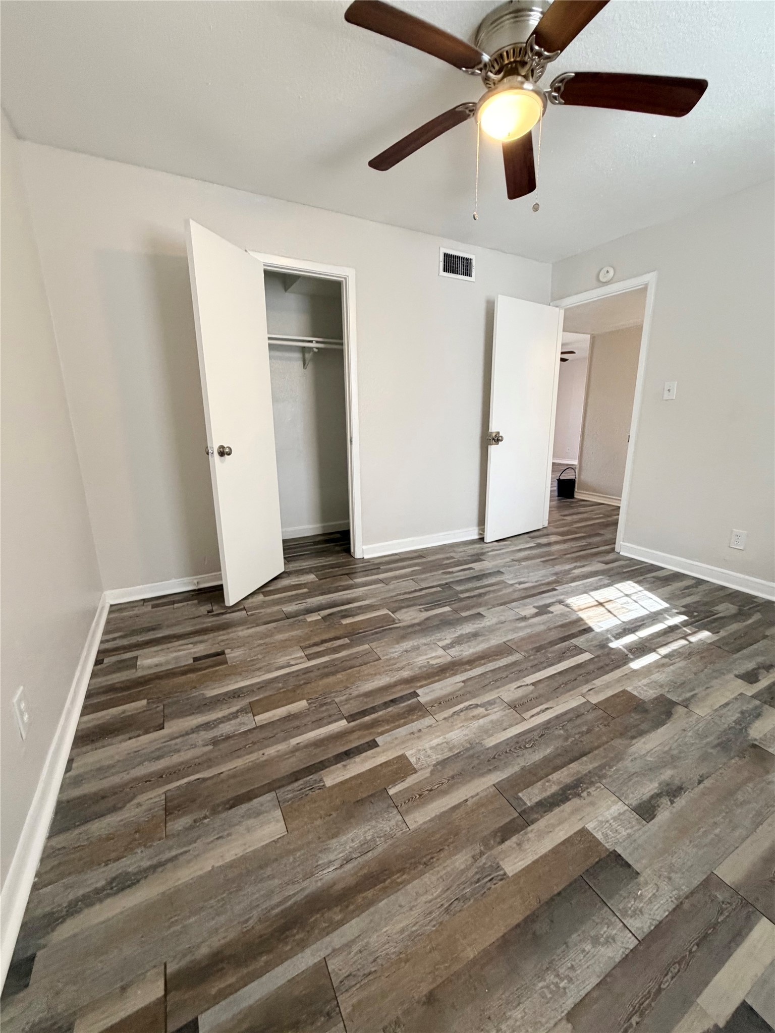 1614 Vauthier Street, Unit 11 La Marque, TX 77568 - Photo 8 of 16 a view of a livingroom with a ceiling fan and window
