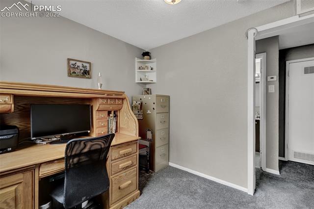 513 Huron Road Colorado Springs, CO 80910 - Photo 22 of 26 Bedroom 3; currently used as an office