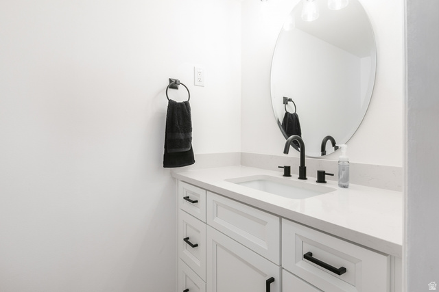 11906 Woodridge Road Sandy, UT 84094 - Photo 15 of 35 Remodeled first floor bathroom, undermount sink, and matte black faucet