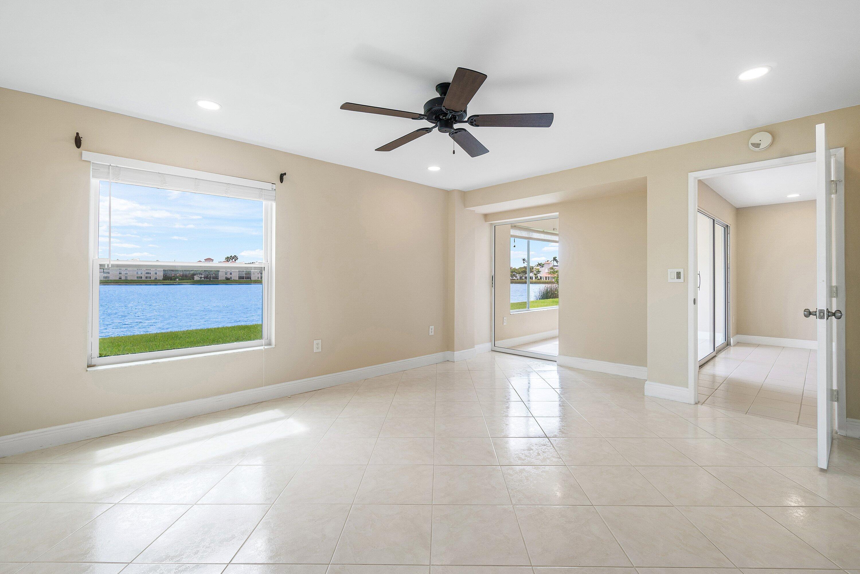 14096 Huntington Pointe Drive, Unit 106 Delray Beach, FL 33484 - Photo 36 of 47 a view of an empty room and window