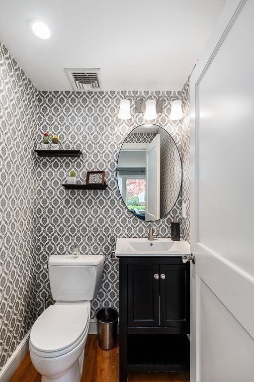 37 Tufts Road Winchester, MA 01890 - Photo 14 of 39 a bathroom with a toilet sink vanity granite and a mirror