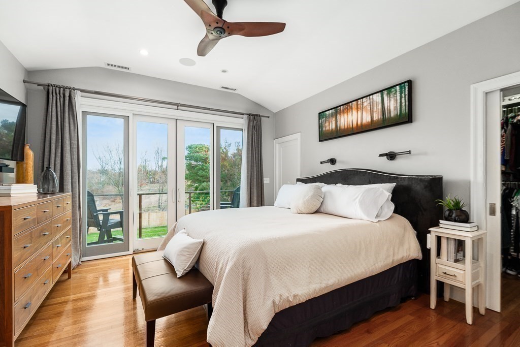 37 Tufts Road Winchester, MA 01890 - Photo 15 of 39 a bedroom with a large bed and a flat tv screen