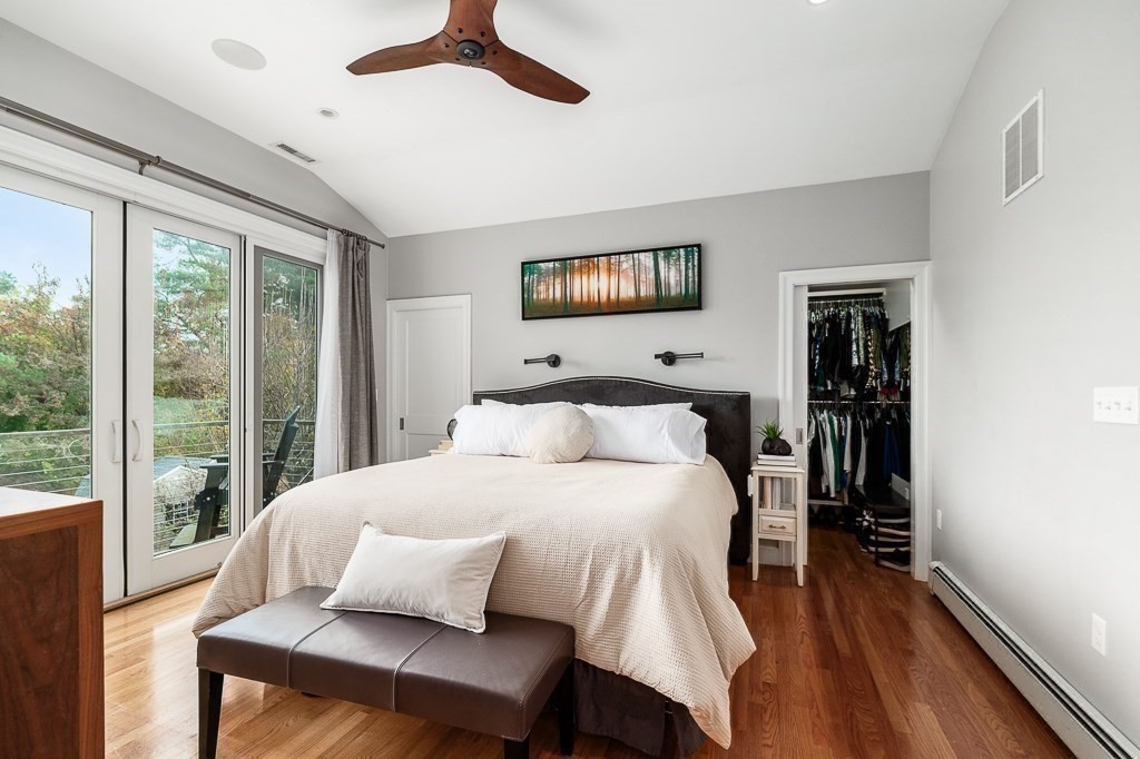 37 Tufts Road Winchester, MA 01890 - Photo 16 of 39 a bedroom with a bed and wooden floor