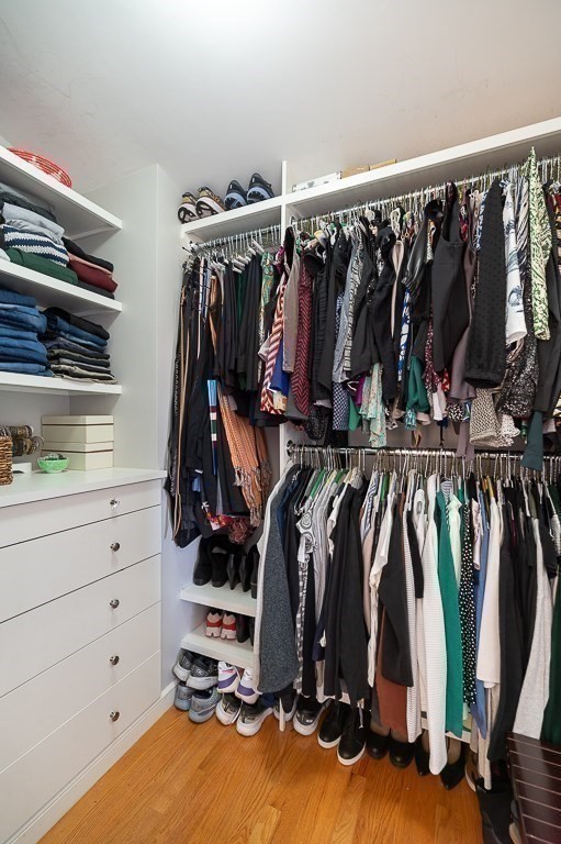 37 Tufts Road Winchester, MA 01890 - Photo 20 of 39 a view of walk in closet with clothes and shoes