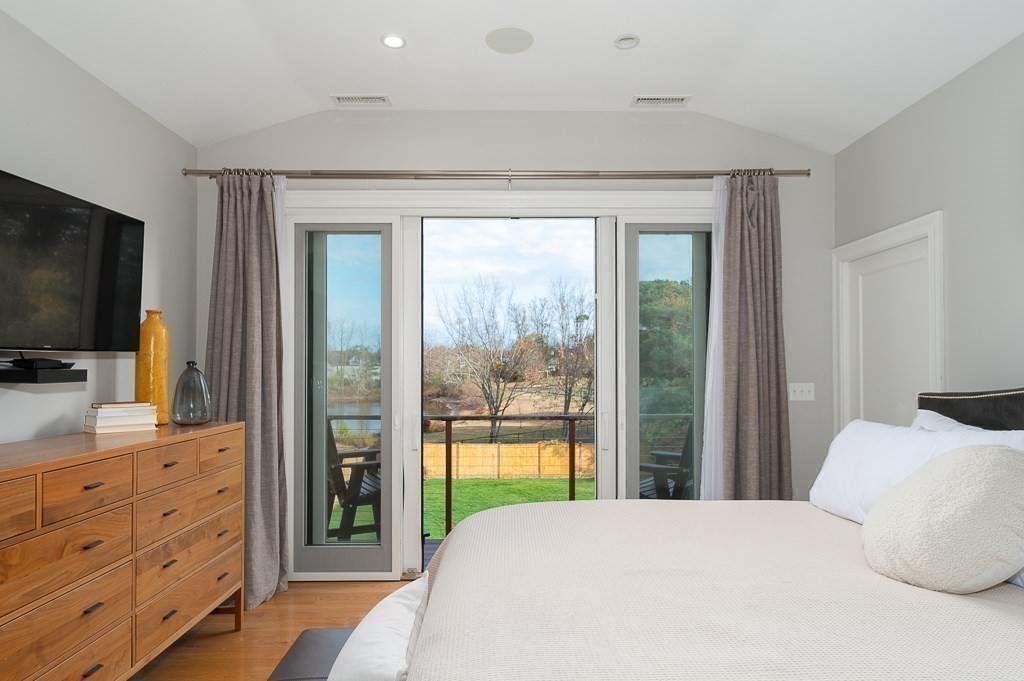 37 Tufts Road Winchester, MA 01890 - Photo 21 of 39 a bedroom with a large bed and a flat screen tv