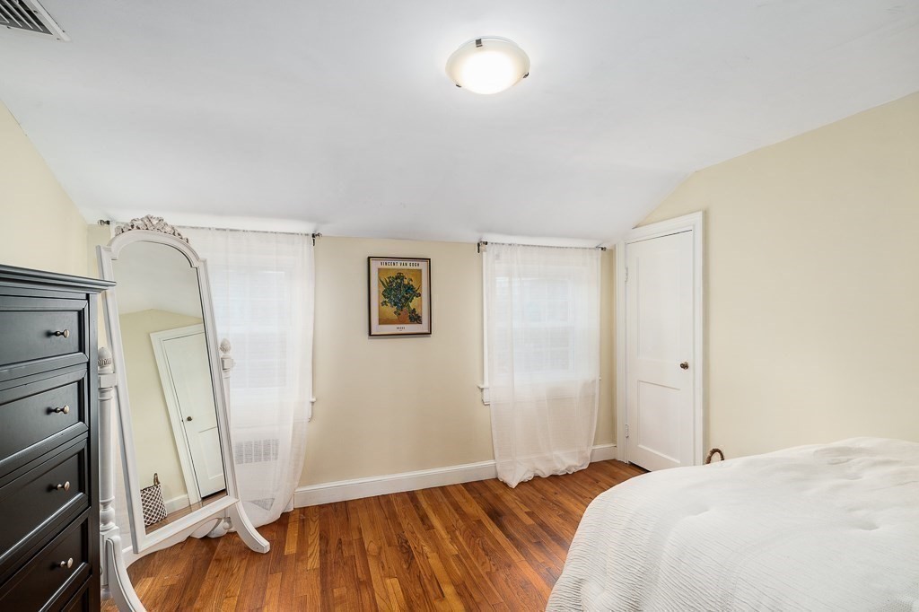 37 Tufts Road Winchester, MA 01890 - Photo 25 of 39 a bedroom with a bed and wooden floor