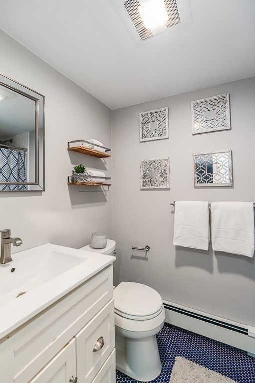 37 Tufts Road Winchester, MA 01890 - Photo 26 of 39 a bathroom with a sink a toilet and mirror