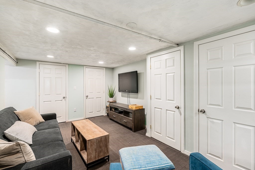 37 Tufts Road Winchester, MA 01890 - Photo 27 of 39 a living room with furniture and a flat screen tv