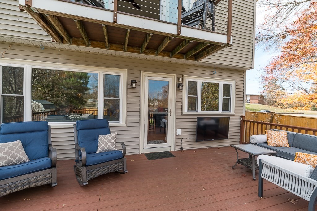37 Tufts Road Winchester, MA 01890 - Photo 31 of 39 a balcony with furniture and a ceiling fan