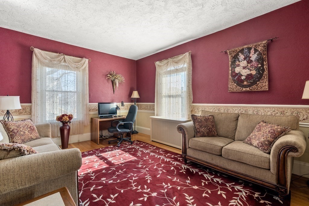 11 Jenison Street Newton, MA 02460 - Photo 13 of 42 a living room with furniture and a rug