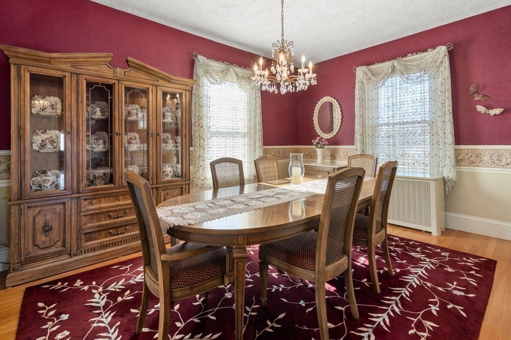 11 Jenison Street Newton, MA 02460 - Photo 15 of 42 a view of a dining room with furniture and chandelier