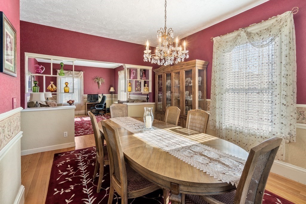 11 Jenison Street Newton, MA 02460 - Photo 16 of 42 a view of a dining room with furniture and chandelier