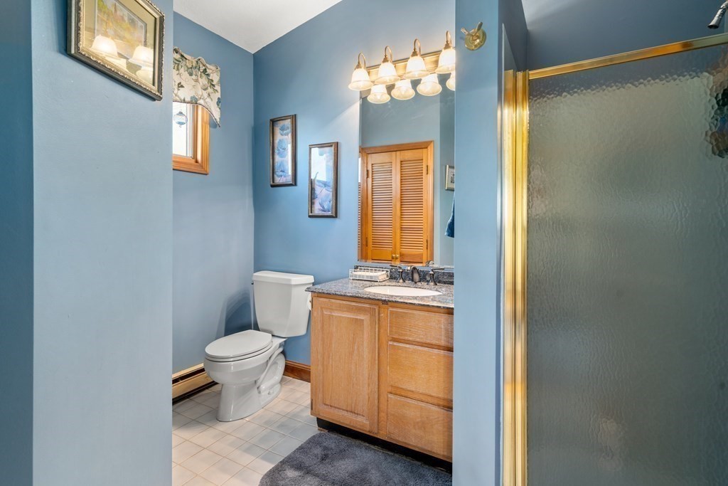 11 Jenison Street Newton, MA 02460 - Photo 17 of 42 a bathroom with a toilet sink and mirror