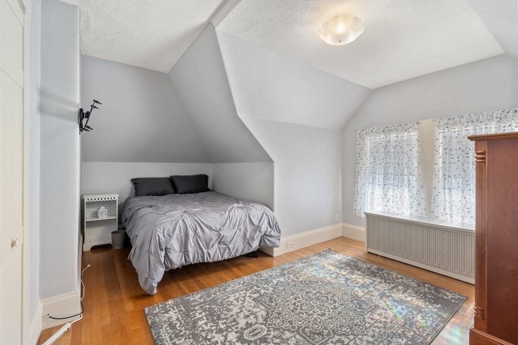 11 Jenison Street Newton, MA 02460 - Photo 21 of 42 a bedroom with a bed and a window