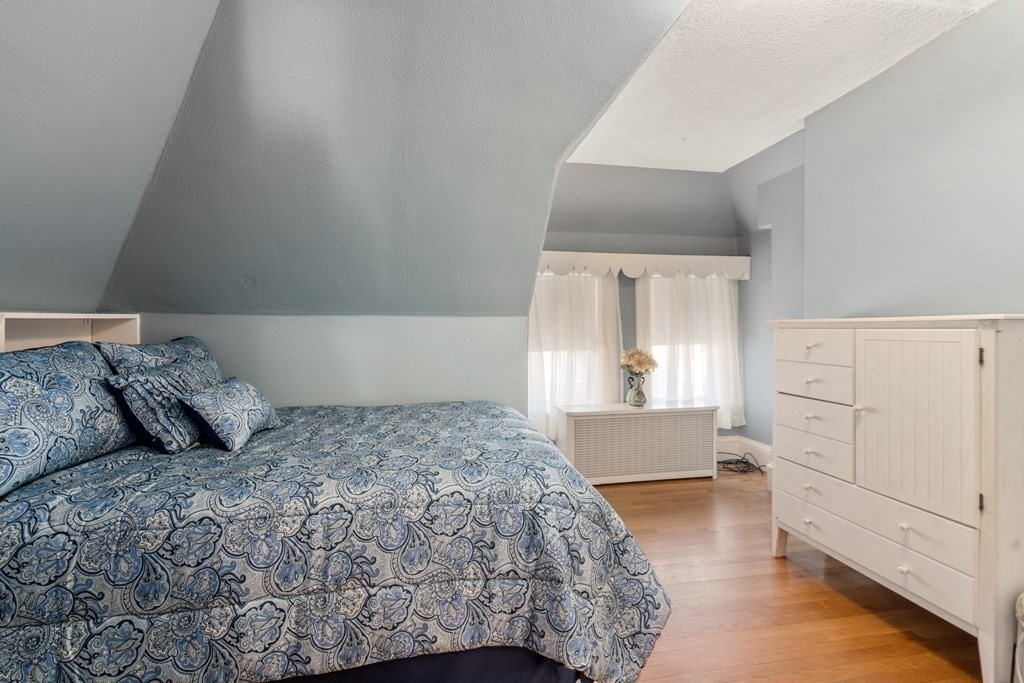 11 Jenison Street Newton, MA 02460 - Photo 23 of 42 a bedroom with a bed and window