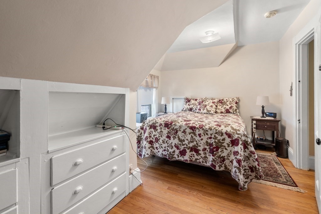 11 Jenison Street Newton, MA 02460 - Photo 24 of 42 a bedroom with a bed and a night stand