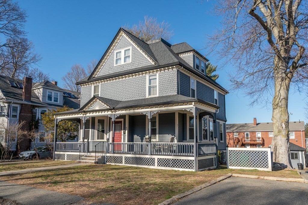 11 Jenison Street Newton, MA 02460 - Photo 3 of 42 a front view of a house with a small yard