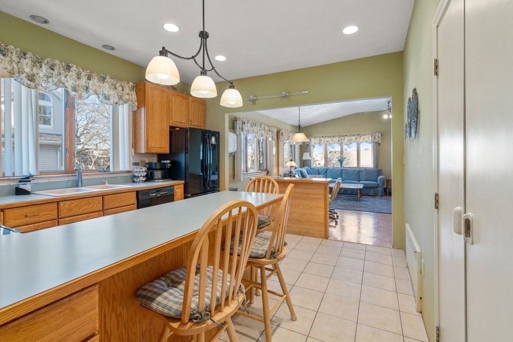 11 Jenison Street Newton, MA 02460 - Photo 10 of 42 a view of a dining room kitchen with furniture and a large window