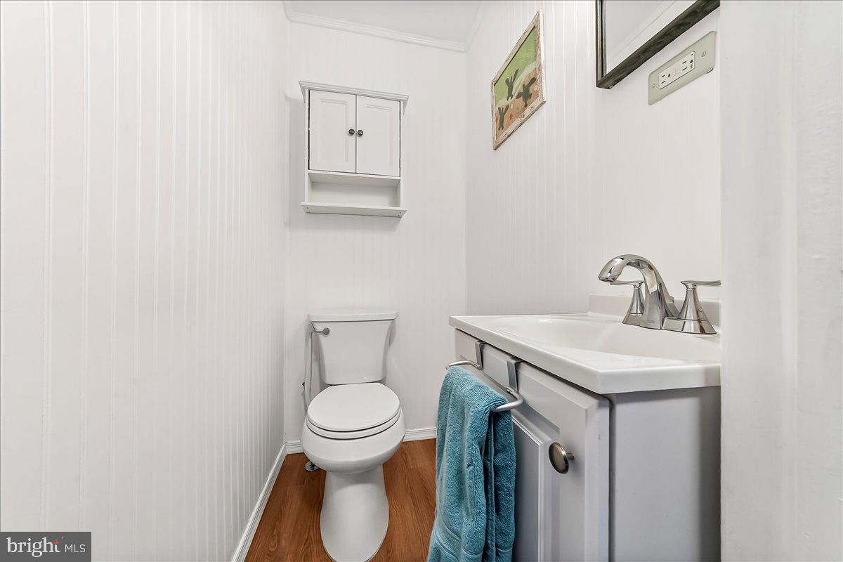 311 Laurel Road Sharon Hill, PA 19079 - Photo 15 of 28 a bathroom with a toilet sink and mirror
