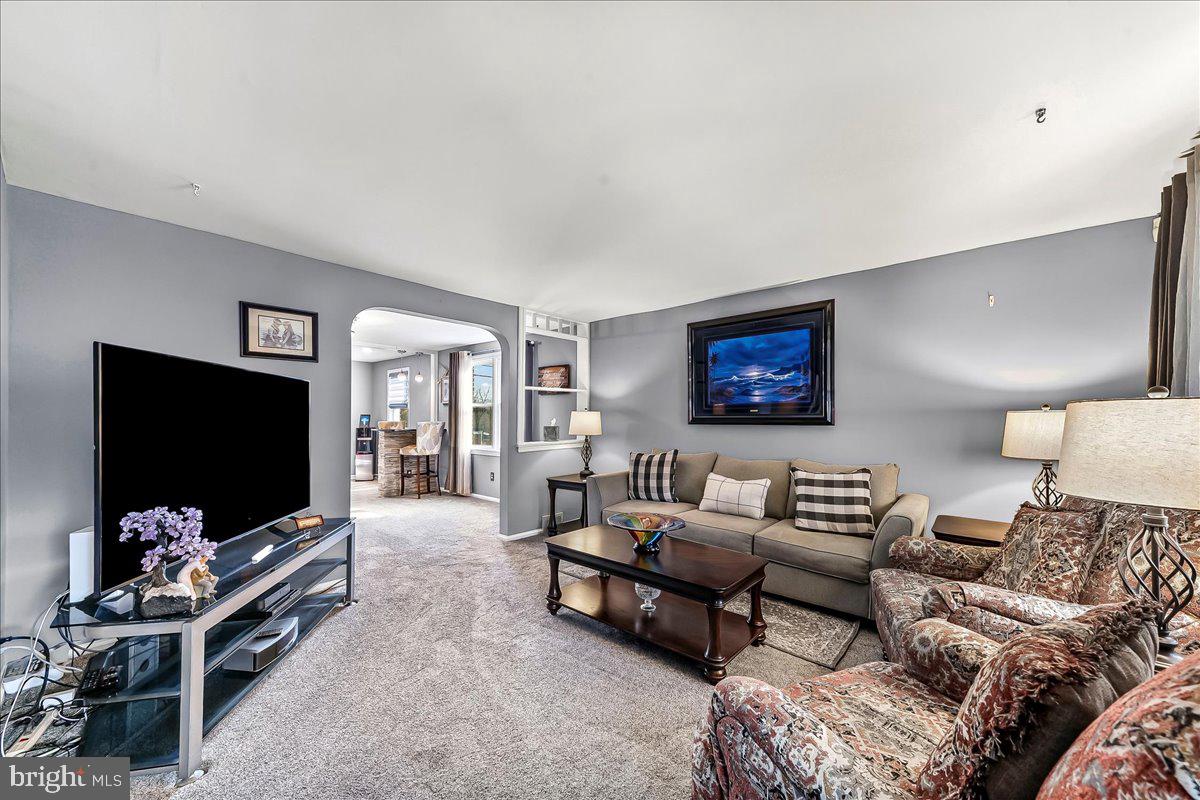 311 Laurel Road Sharon Hill, PA 19079 - Photo 4 of 28 a living room with furniture and a flat screen tv