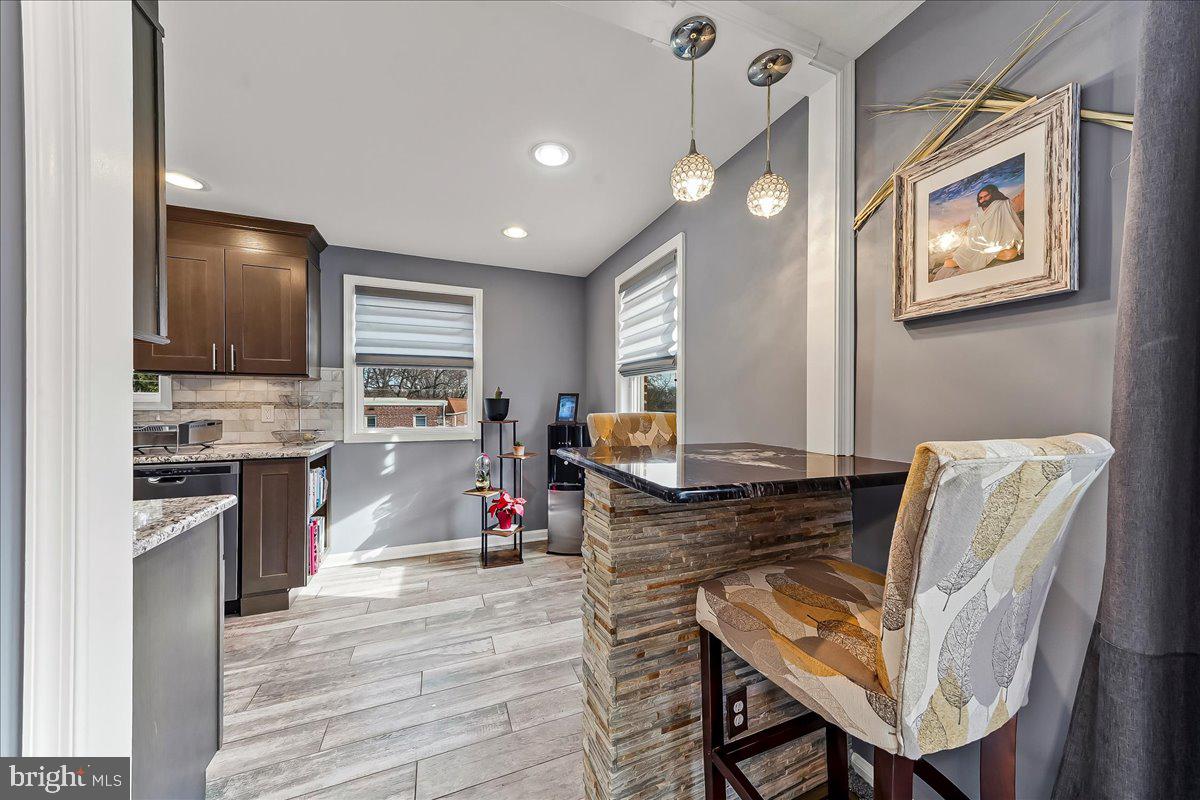 311 Laurel Road Sharon Hill, PA 19079 - Photo 10 of 28 a living room with furniture and kitchen view