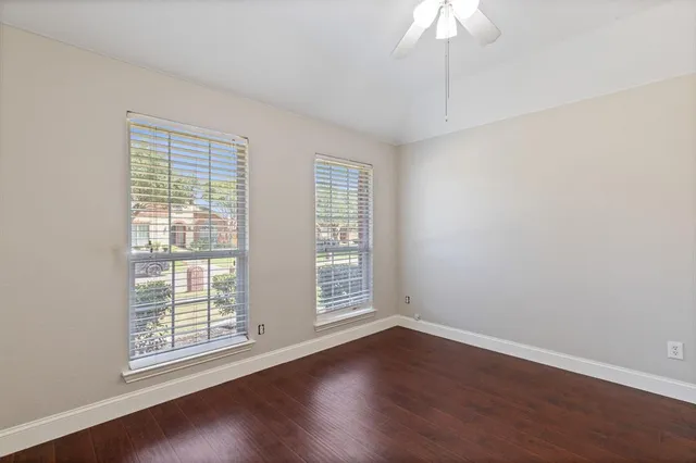a view of cabinets and wooden floor