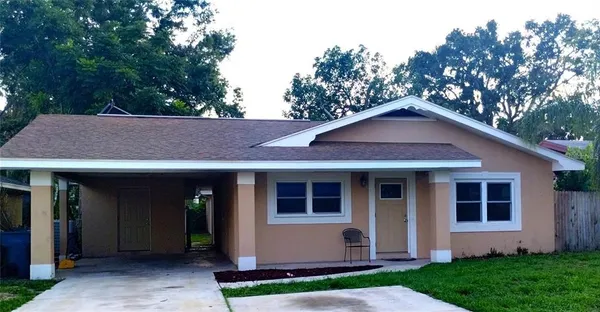 a house with trees in the background