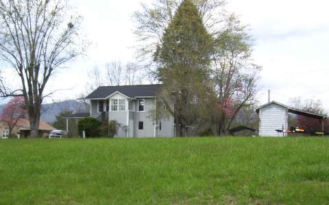 278 Riverside Drive, Unit A Hayesville, NC 28904 - Photo 5 of 5 a view of a house with a yard