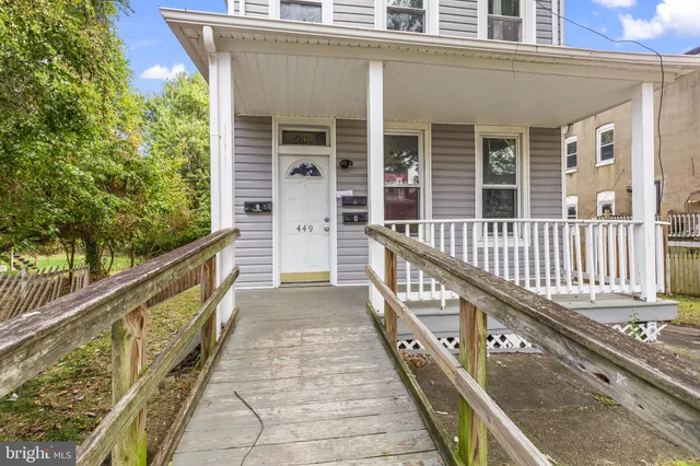 a view of balcony with wooden floor and fence