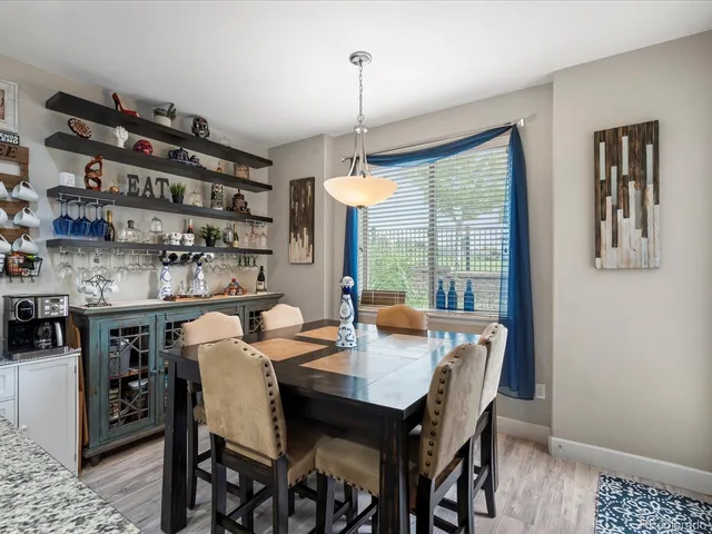 a kitchen with granite countertop a stove top oven microwave and cabinets