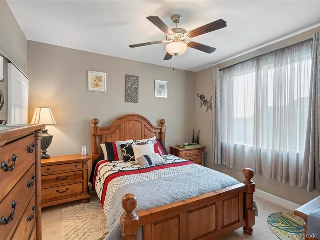 a view of a livingroom with furniture and a flat screen tv