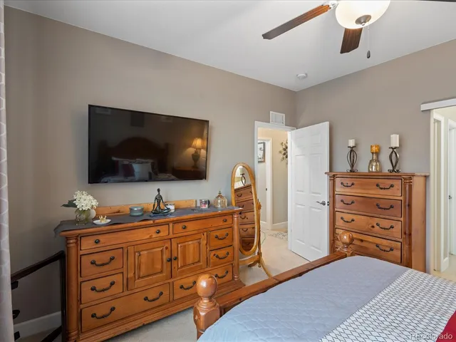 a bathroom with a granite countertop sink a mirror and a shower
